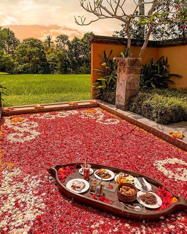 Floating breakfast and The art of Flower Pool Elegance at a private pool in Tanah Gajah, a resort by Hadiprana, Ubud, Bali.